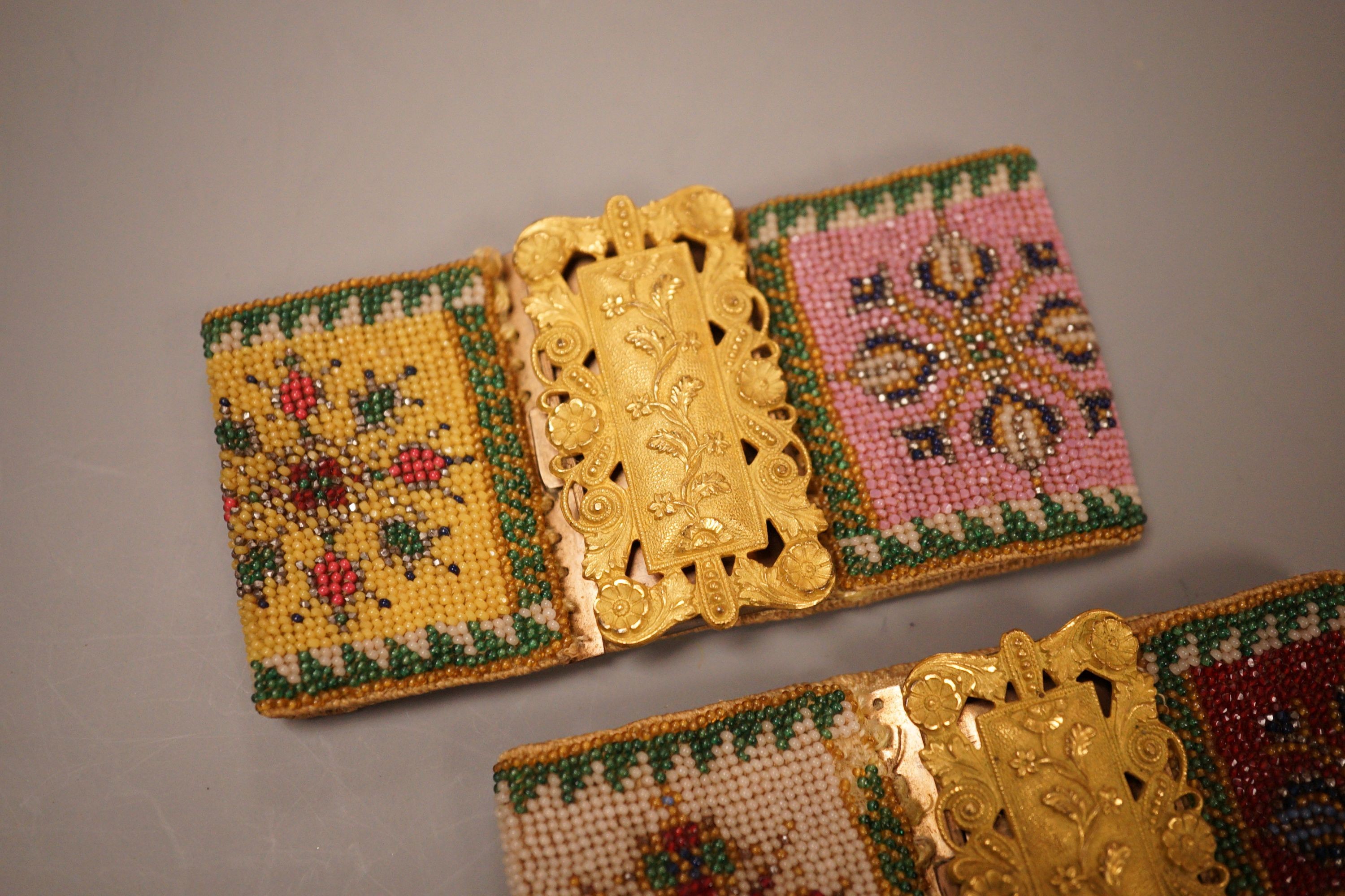 A pair of late Regency fine beadwork and ormolu bracelets